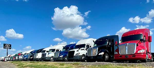Row of trucks on Oliver Truck Center lot